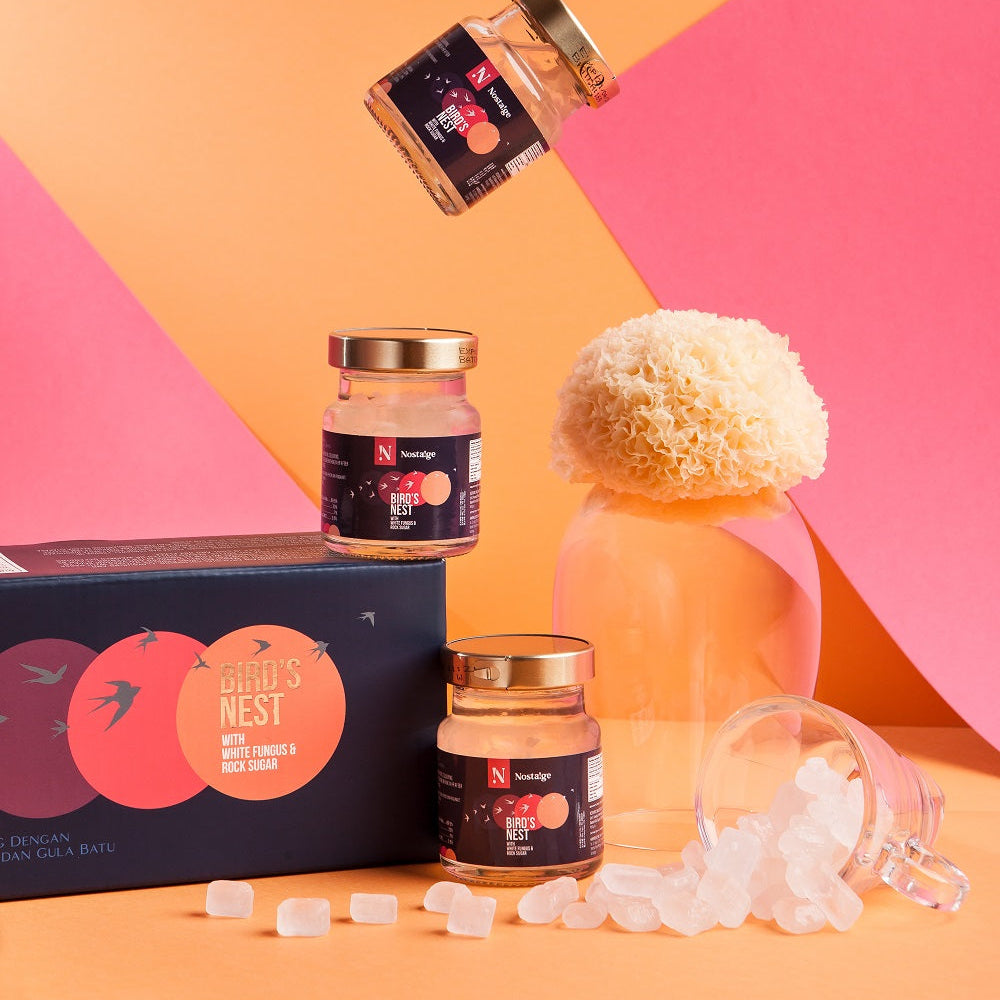 Halal Certified Bird's Nest set with jars, a bottle, and packaging on a colorful geometric background
