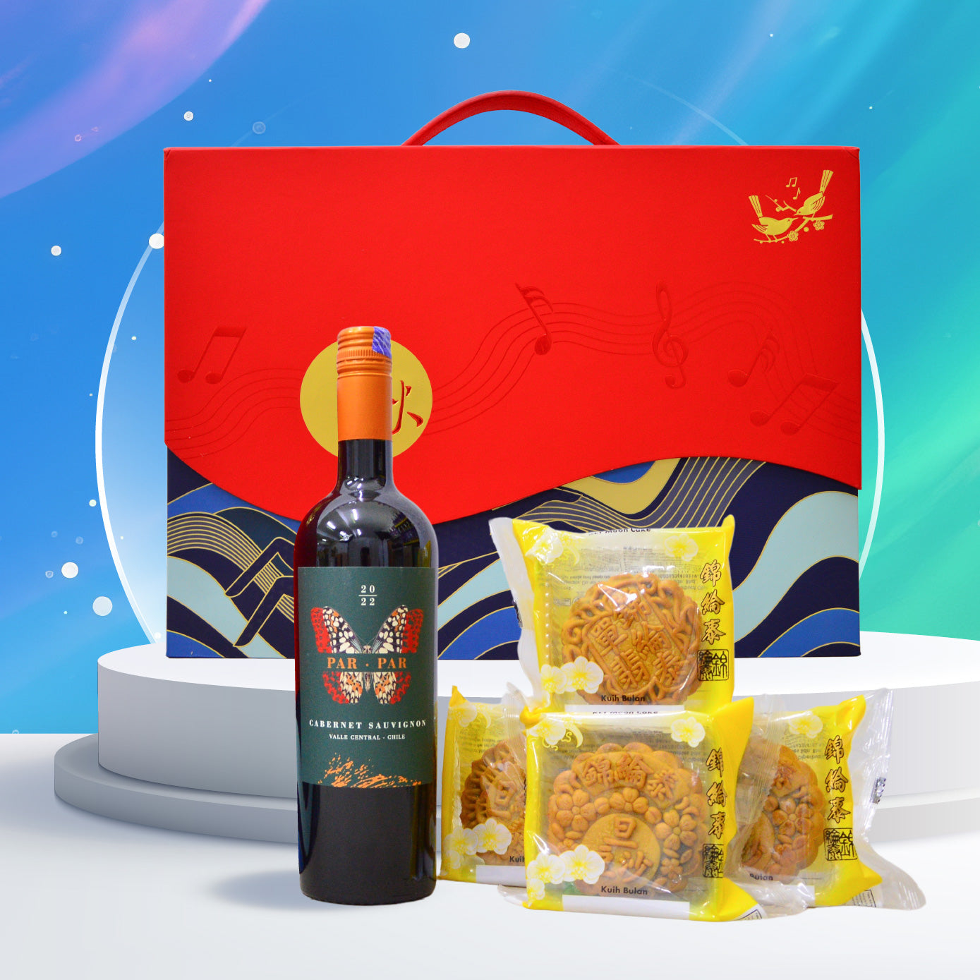 Wine bottle and mooncakes in front of a red gift box with a blue and white background