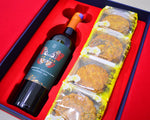 Wine bottle and mooncakes in a red box