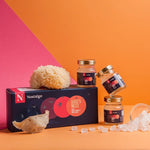 Jars of bird's nest and a box labeled 'Nostalgie' on an orange and pink background