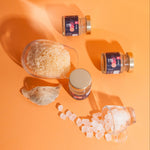 Jars of bird's nest and a glass container on an orange background