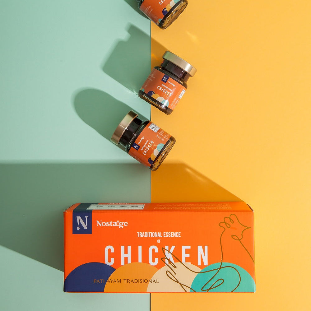 Three small jars of 'Traditional Essence of Chicken' by Nostalgia on a colorful background