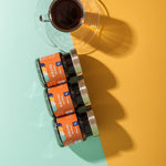 Nescafe coffee packaging with a cup of coffee on a colorful background