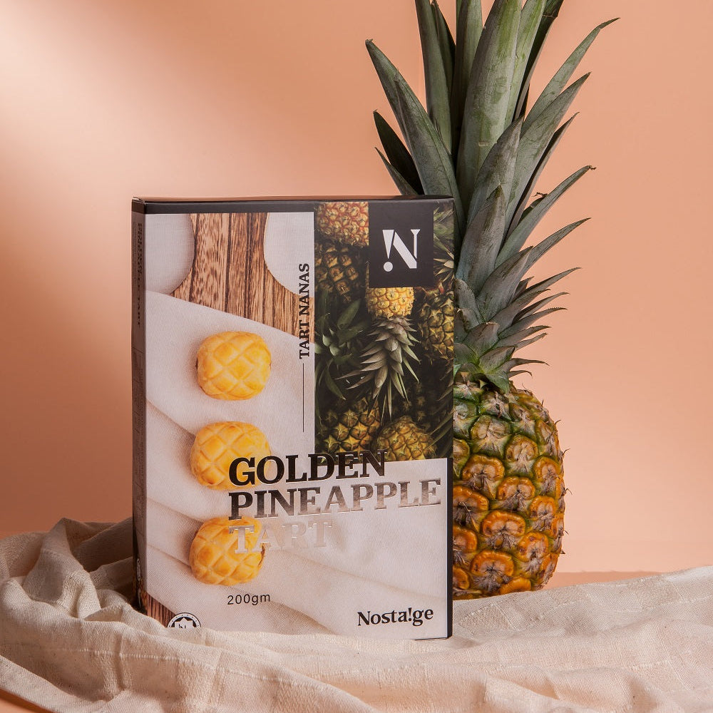 Nostalgia Golden Pineapple package with a pineapple on a beige background