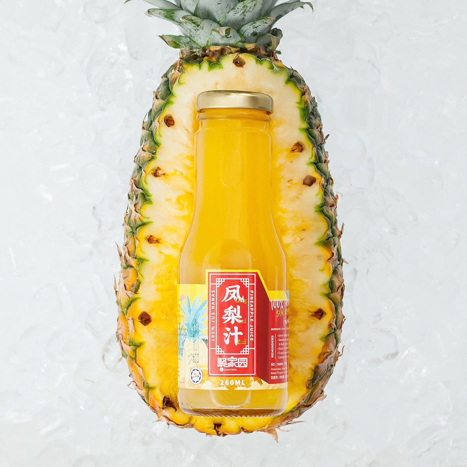 Bottle of pineapple juice inside a halved pineapple on a light background